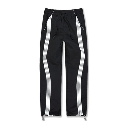 Jordan Craig Velocity nylon track pant in black with twin white side stripes