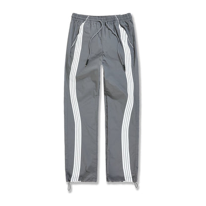 Jordan Craig Velocity nylon track pant in charcoal with twin white side stripes