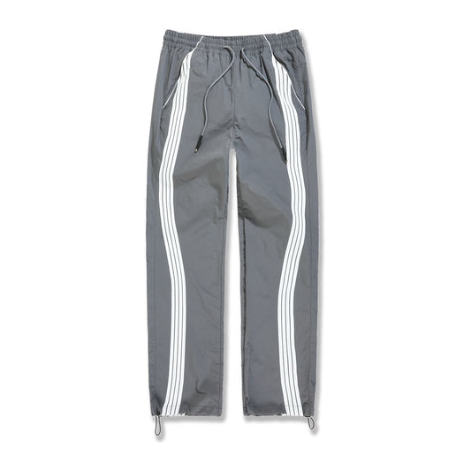 Jordan Craig Velocity nylon track pant in charcoal with twin white side stripes
