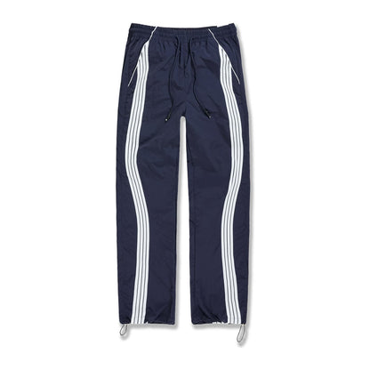 Jordan Craig Velocity nylon track pant in navy with twin white side stripes