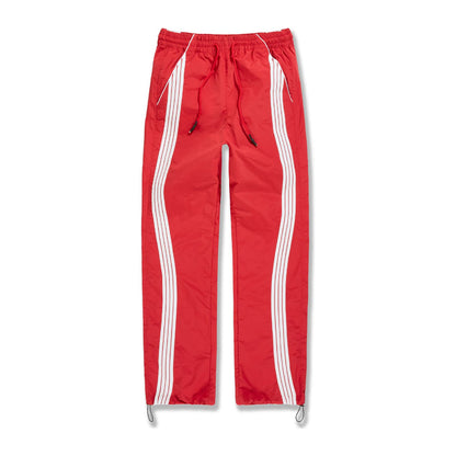 Jordan Craig Velocity nylon track pant in red with twin white side stripes