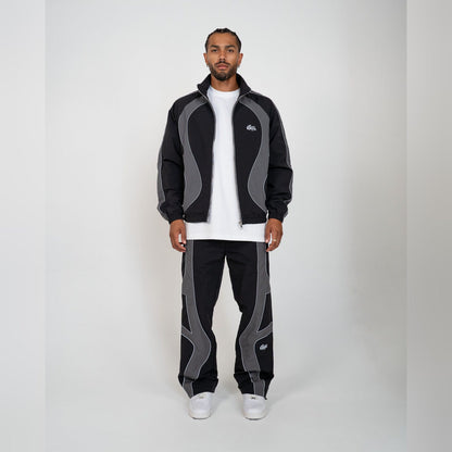 EPTM Syntax track set in black worn, jacket and pants together